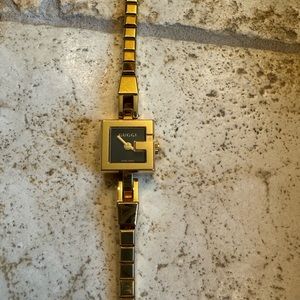 Gold dainty Gucci watch